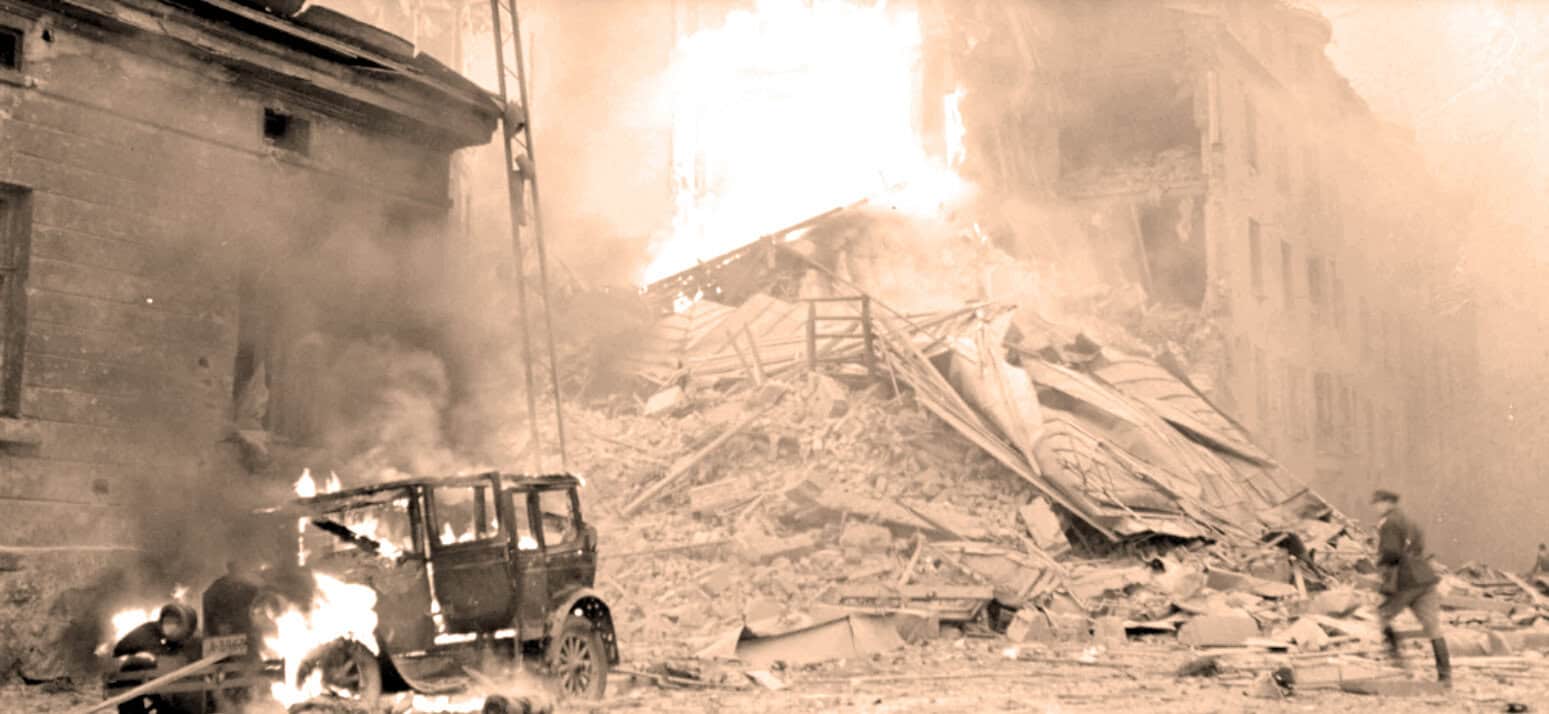 Explosive building collapse during a disaster, with debris, fire, and smoke, highlighting historical news and emergency response scenes.