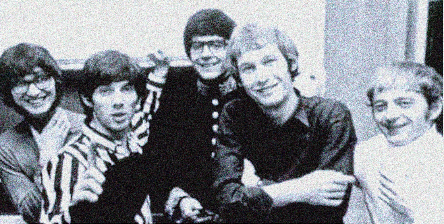 Vintage black and white photo of The Beatles, members John Lennon, Paul McCartney, George Harrison, and Ringo Starr, during the 1960s, showcasing iconic music history and pop culture.