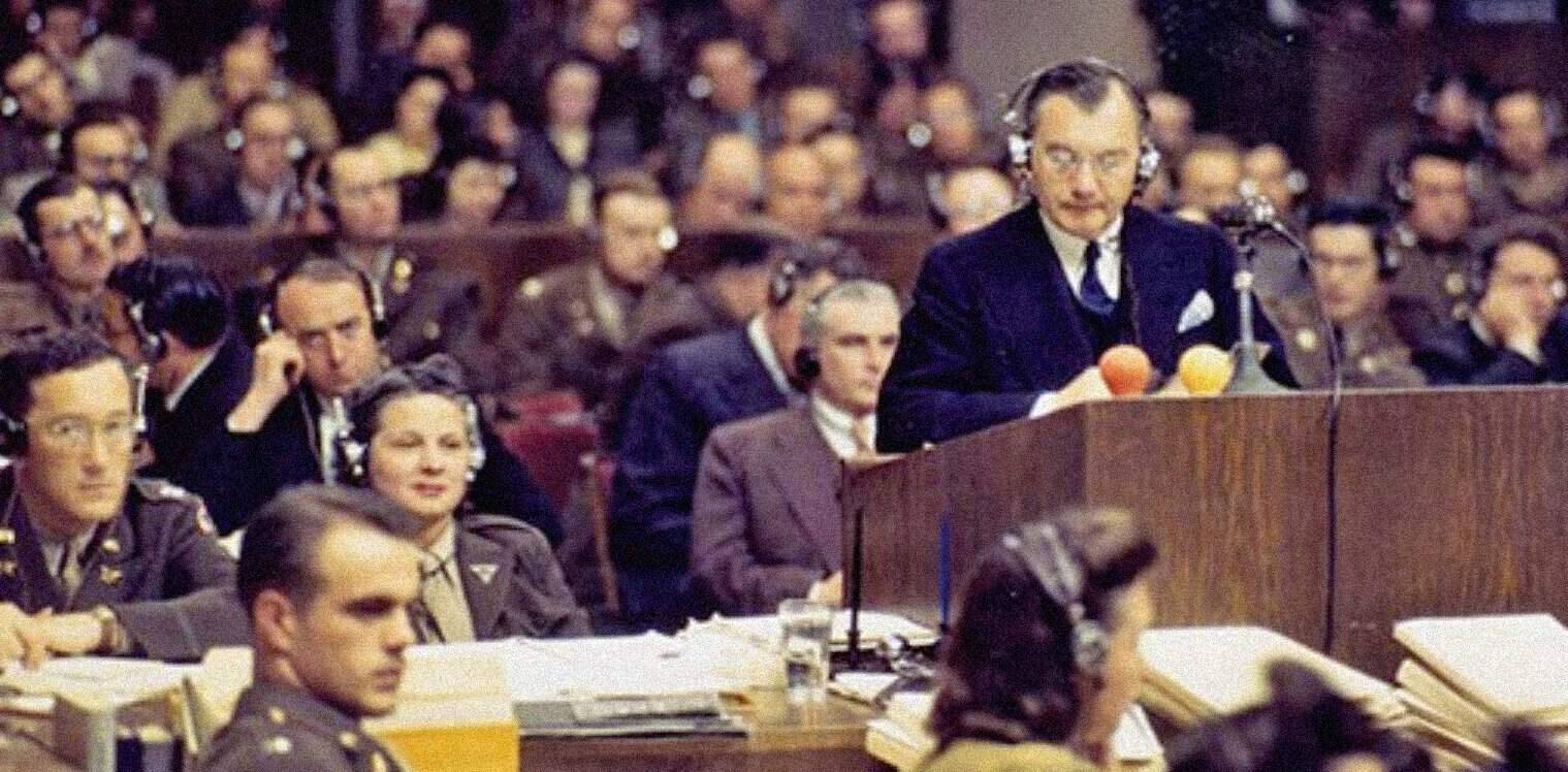 Photo of a historical radio broadcast at the Nuremberg Trials, showcasing wartime legal proceedings, with lawyers and officials wearing vintage military uniforms, podcast, news archive, history, and music discussion.