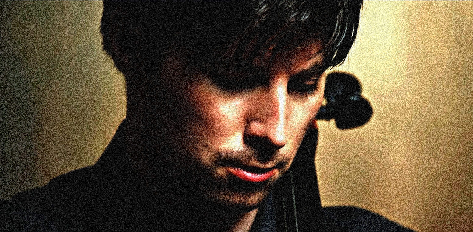 Young man with headphones recording radio broadcast or music playlist at home or studio, vintage style, nostalgic vibe, focus on digital sound archive, history, news, and music preservation at Past Daily.