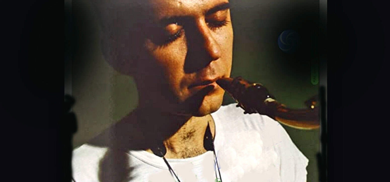 A woman playing a wind instrument, showcasing music and audio archives related to news, history, and music; nostalgic sound recording session.