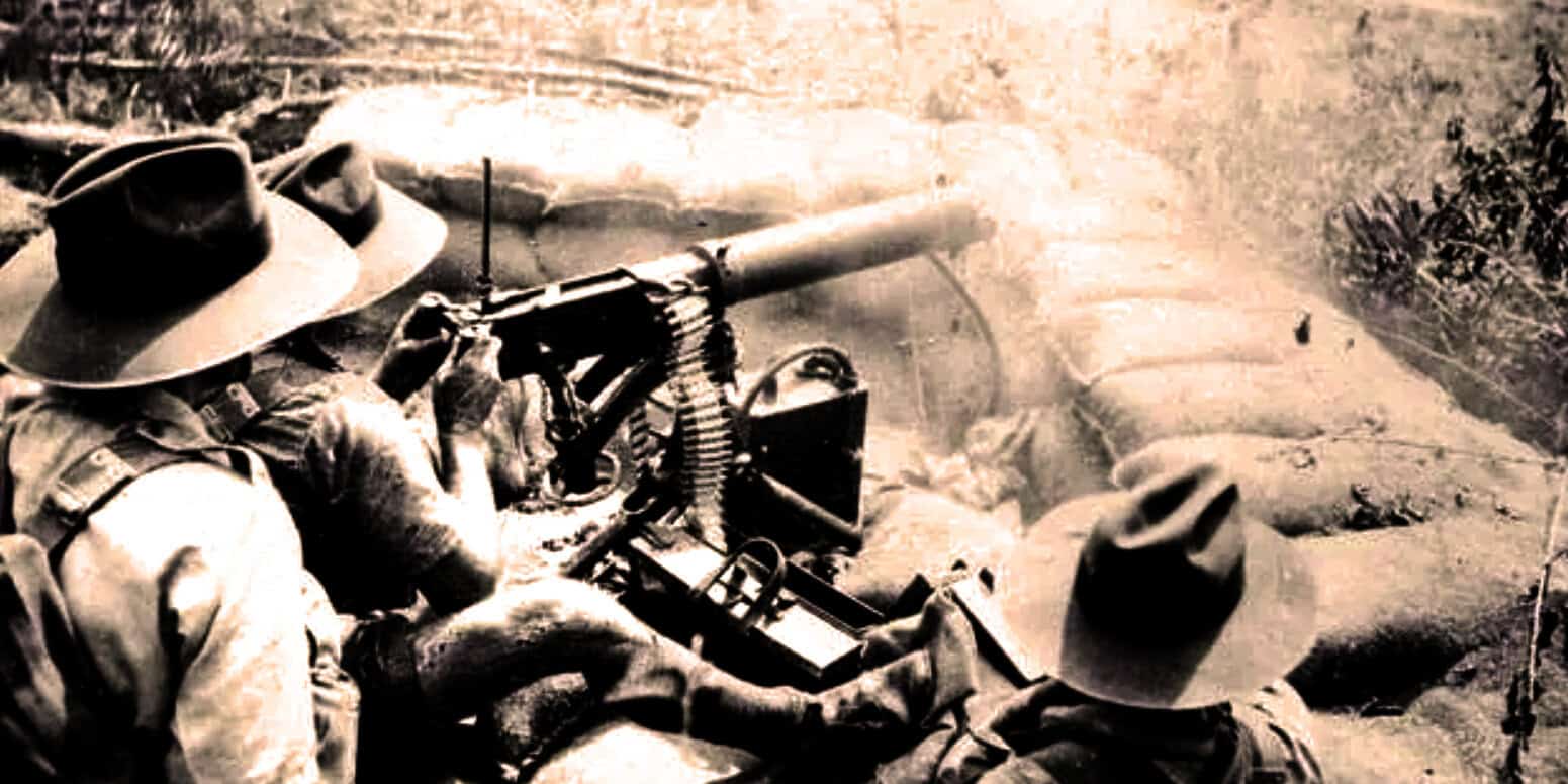 Muzzle-loaded artillery soldier during wartime, historical black and white photo, vintage military scene illustrating news and history archive.