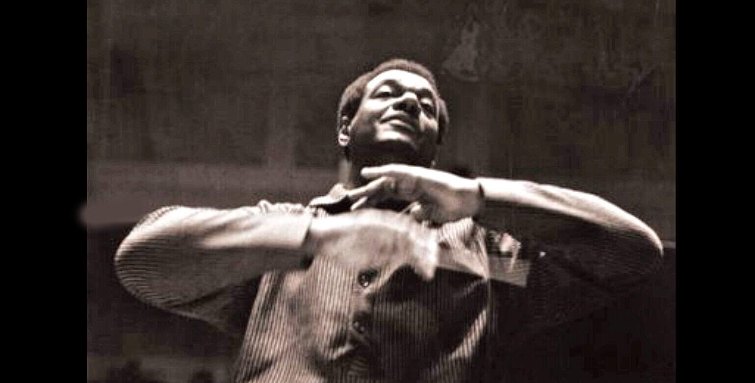 Vintage jazz dancer performing on stage, black and white, lively motion, historic music performance, classic jazz performance image.