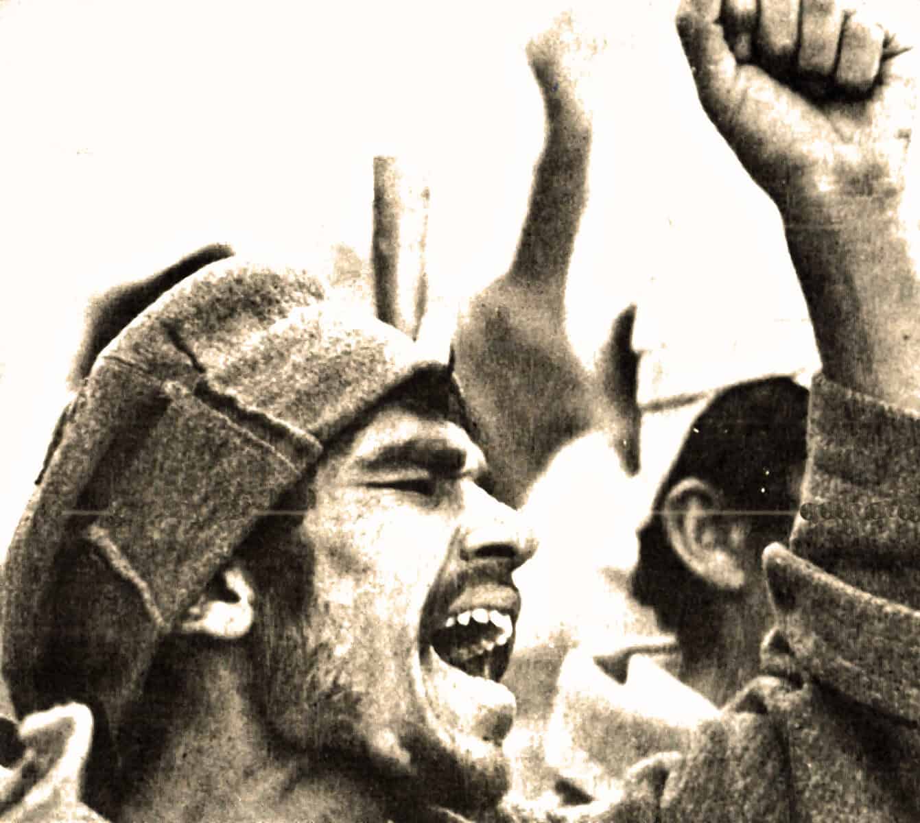 Freedom fighter passionately shouting during a protest or rally, symbolizing resistance and activism, captured in black and white for historical significance.
