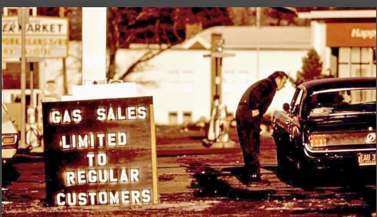 Gas sales limited to regular customers at vintage gas station and classic car refueling scene, historical automotive archive, nostalgic car culture image, reminiscent of past daily sound archive of news and history.
