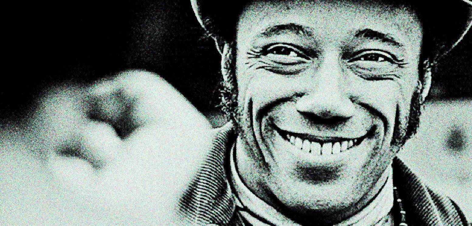 African American woman smiling, wearing a hat and jewelry, in a vintage black-and-white photograph, representing history and culture on the Past Daily sound archive website.