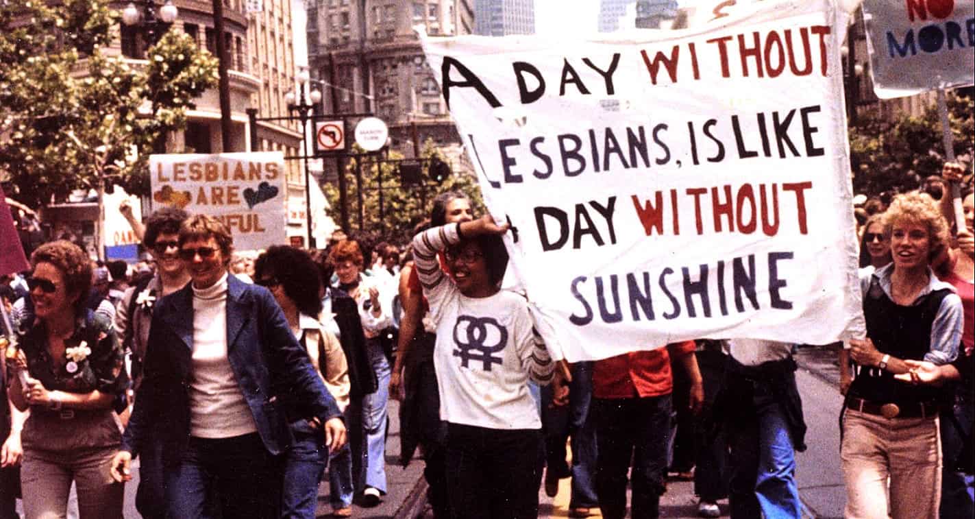 Lesbians pride march protest activism historical women's rights movement 1980s.