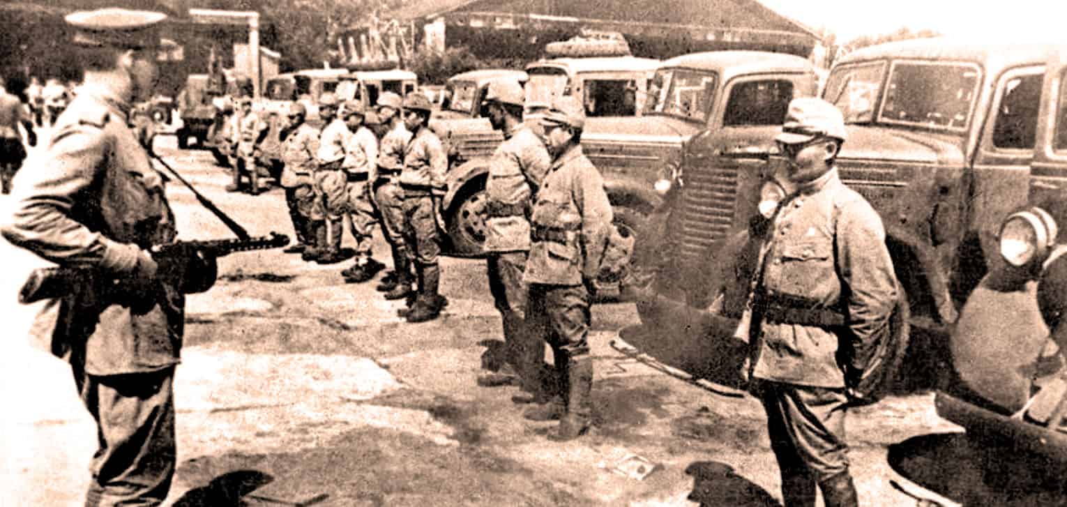 Troops military soldiers historical black and white photo 1930s, vintage war scene with trucks and soldiers, archival image of wartime history, classic photo from past daily news archive, historical military photo for news and history context.
