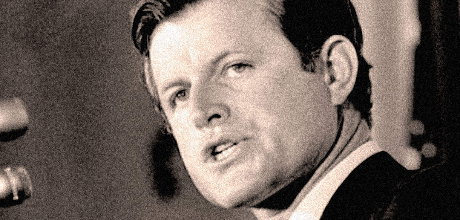 Vintage black and white photo of a charismatic male singer with styled hair, likely performing or at a radio event, highlighting classic music history and entertainment.