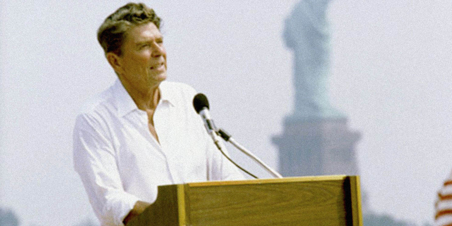 Historic speaker at a rally or event, featuring prominent public figures, with a monument in the background, emphasizing news, history, and music archives on Past Daily.