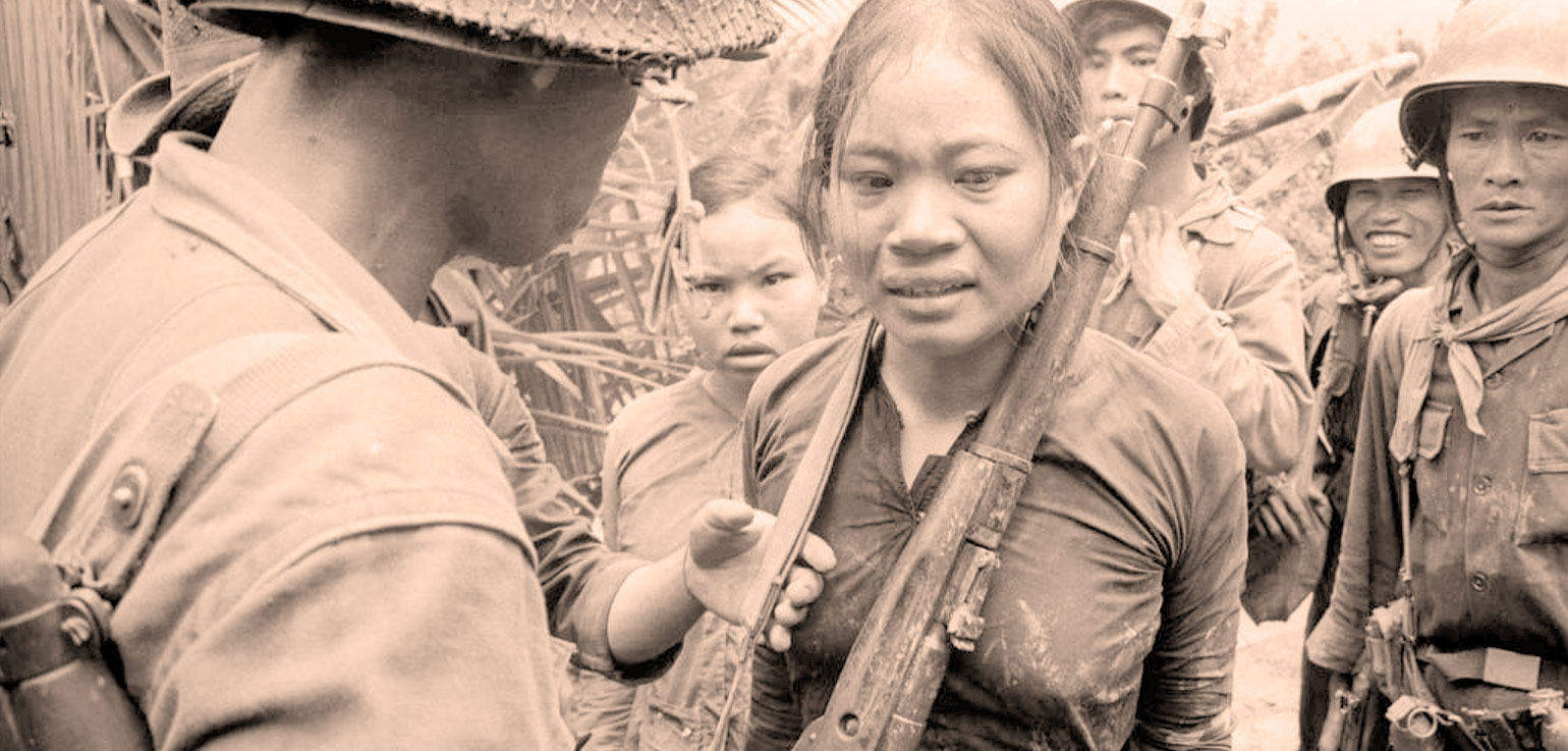 Vietnam War soldiers and civilians, historical wartime scene in sepia tone, highlighting news, history, and music archives from Past Daily.