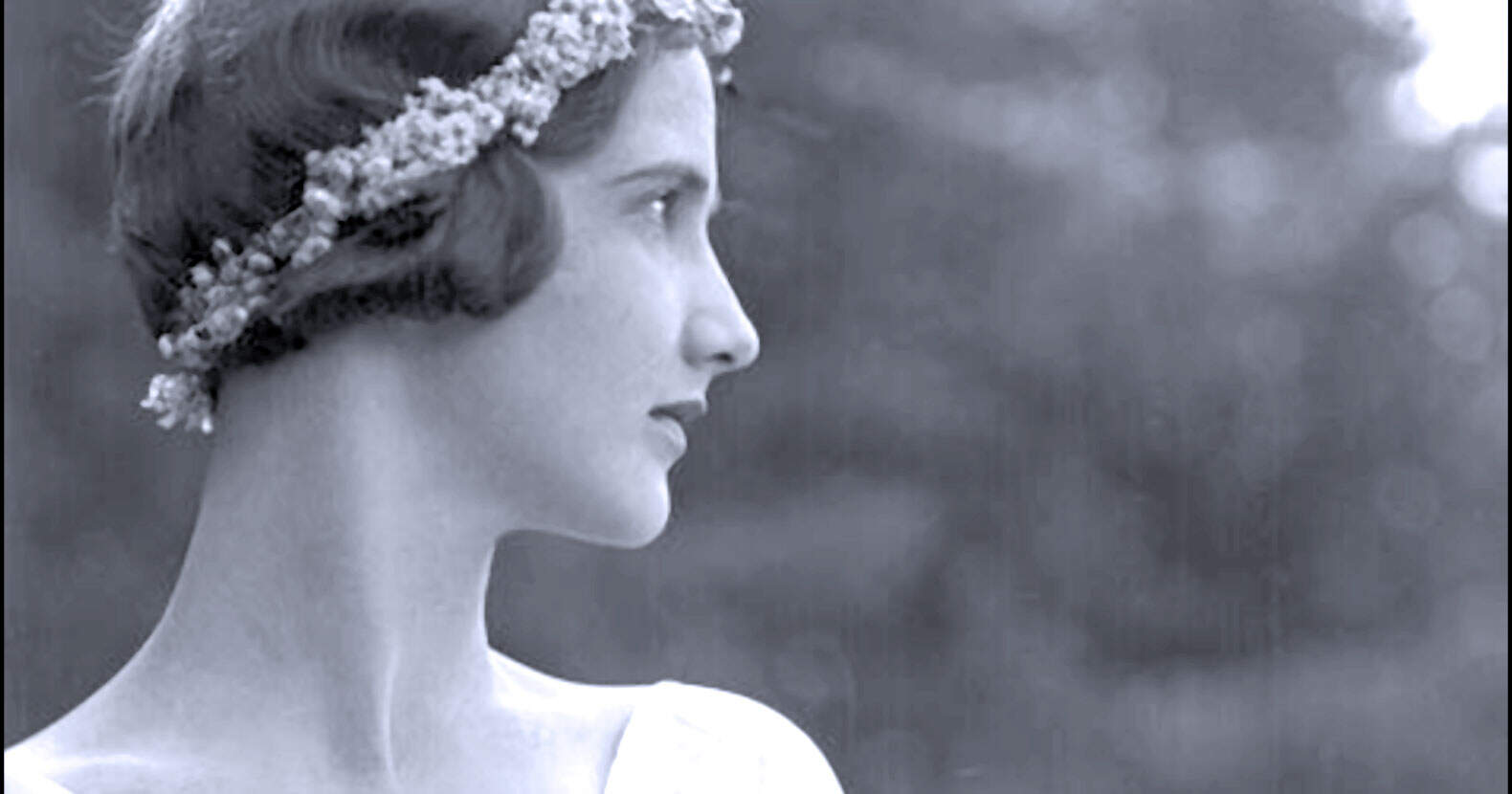 Elegant woman with a floral headband in black and white, symbolizing timeless beauty and classic style, ideal for historical radio archives, vintage music, and nostalgic news stories.