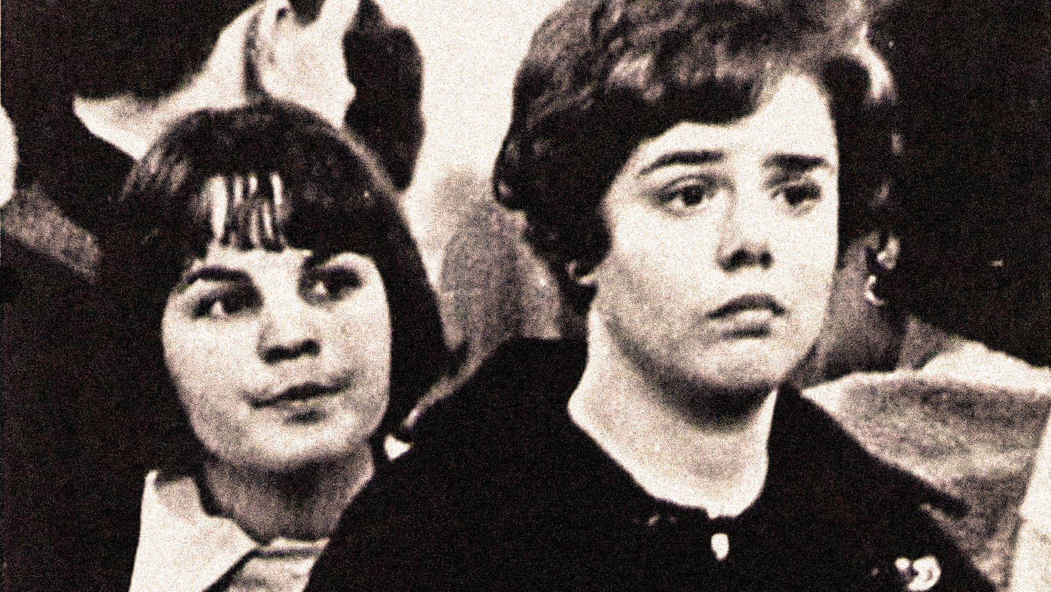 Vintage black and white photo of two women from the 1960s, with expressive hairstyles and fashion, representing history, culture, and musical icons in the audio archives of Past Daily.