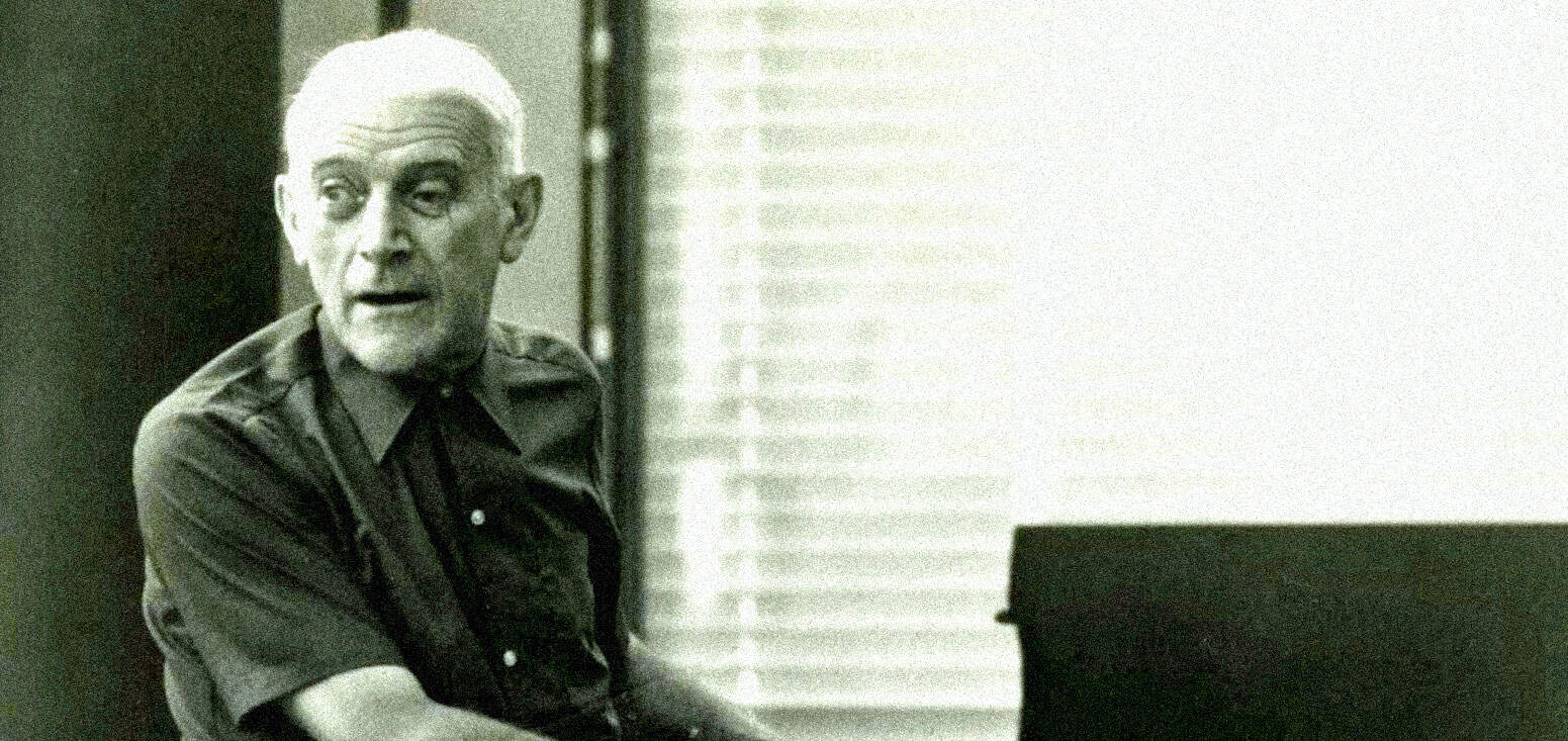 Vintage man playing piano in a recording studio, emphasizing historical music and sound archives for nostalgia and entertainment.