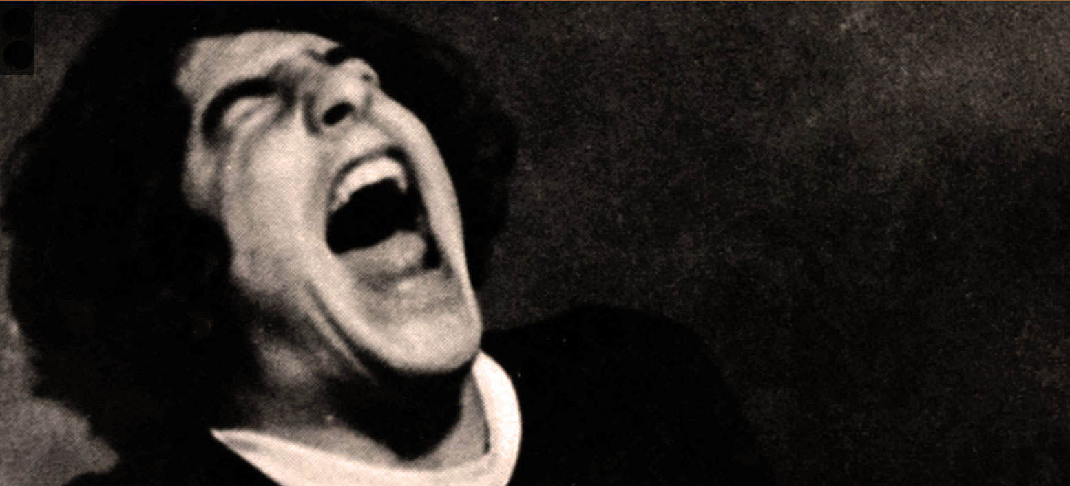 Rock singer passionately performing at a concert, black and white photo highlighting music history and iconic performances, vintage music archive image for sound recording preservation.