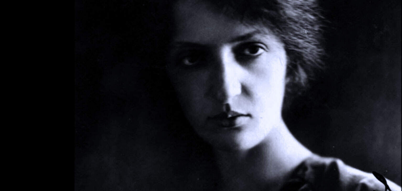 Black and white portrait of a woman with intense gaze, highlighting historical news and music archives, perfect for a sound archive of news, history, and music.