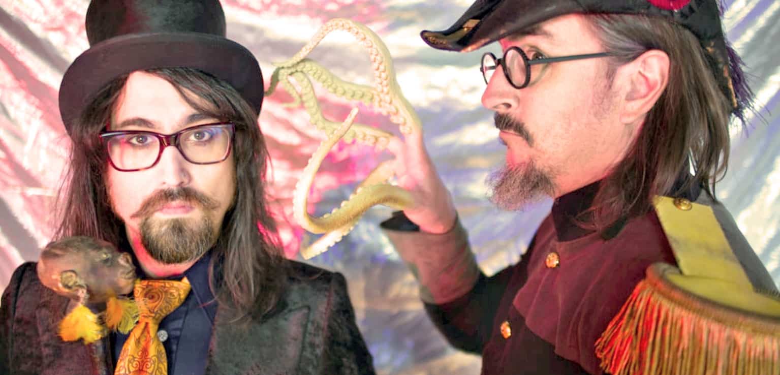 Colorful fantasy portrait of two men in vintage costumes with snake and bird, creative artistic style.