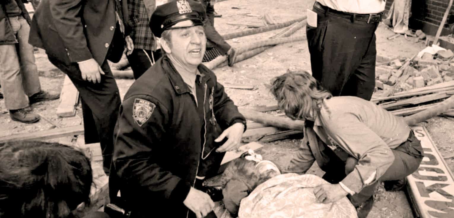 Firefighter emergency rescue scene at disaster site during a crisis, black and white photo of police and rescue workers helping injured personafter accident, news, history, and music archive image.