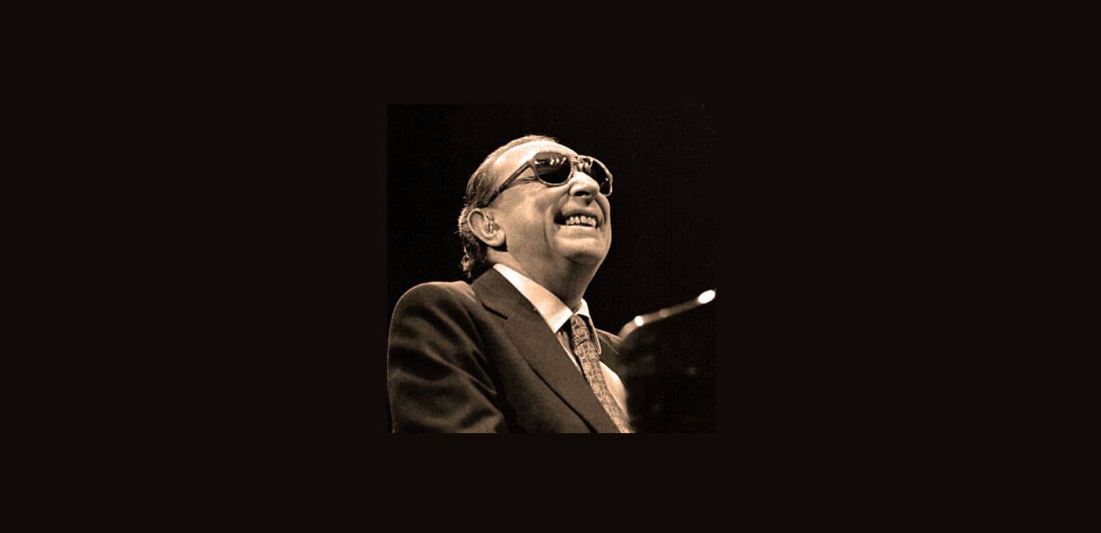 Vintage jazz musician wearing sunglasses and a suit, performing on stage as part of a sound archive of news, history, and music at Past Daily.