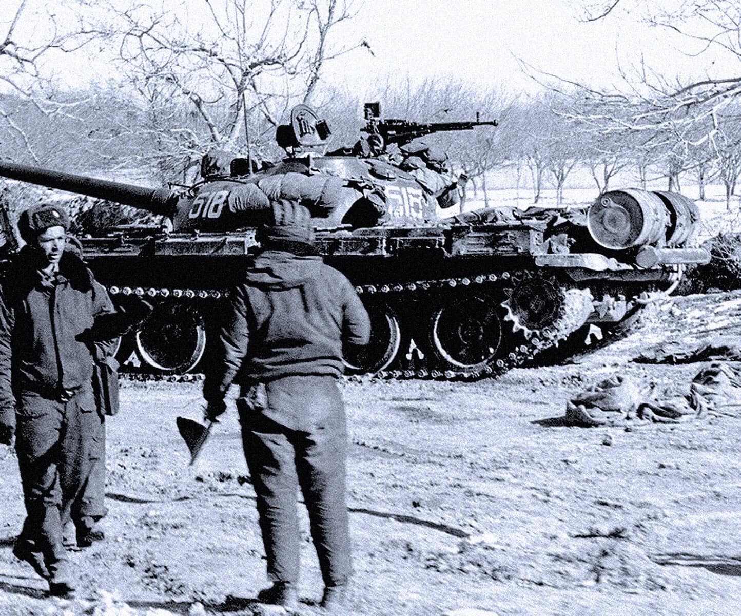 Destroyed tank amidst winter landscape, historic warfare scene with soldiers, snow-covered trees, and military equipment from past conflicts.