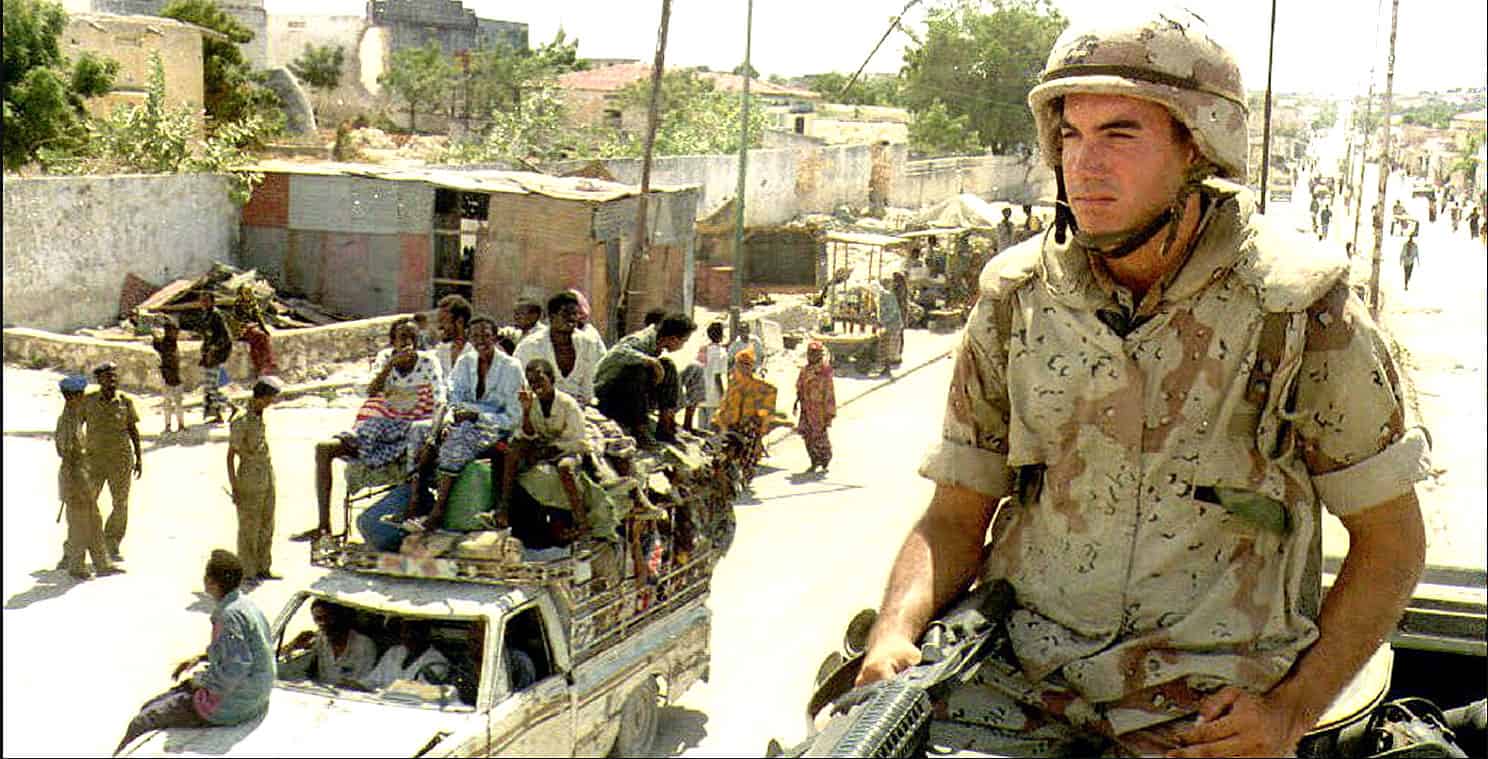 Grenade launcher soldier amidst urban conflict, news footage, military conflict, war zone, historical news archive, music and history in conflict areas.