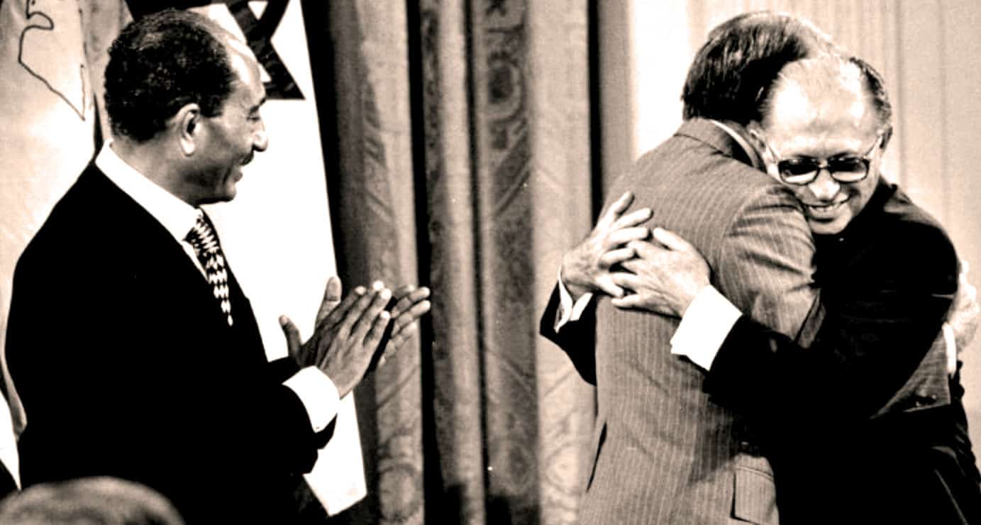 Ubuntu Historical Meeting: Two men embrace warmly during a historic event, showcasing friendship, celebration, and diplomatic ties. A notable moment captured in black and white, symbolizing alliances and social connection.
