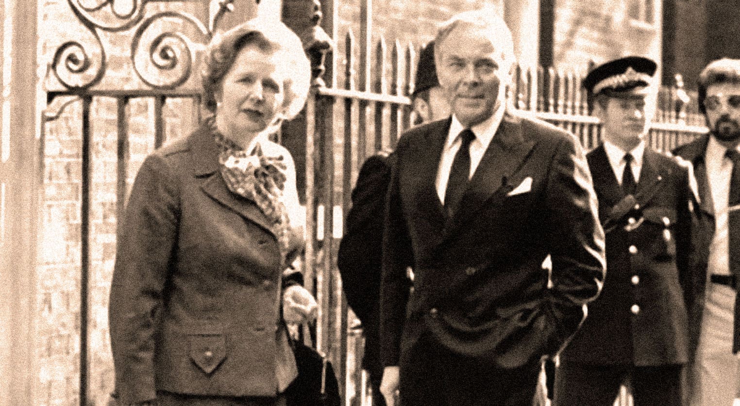 Photograph of British political figures outside a historical building, illustrating significant moments in news, history, and politics. Vintage media capturing iconic personalities and events for sound archives.