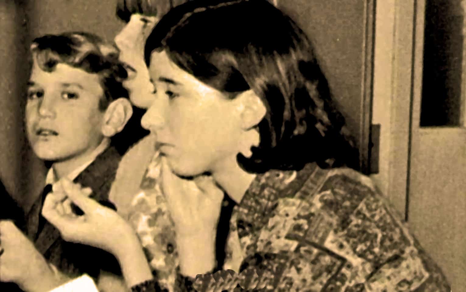 Unknown girl and boy with vintage appearance for historical news and music archive.