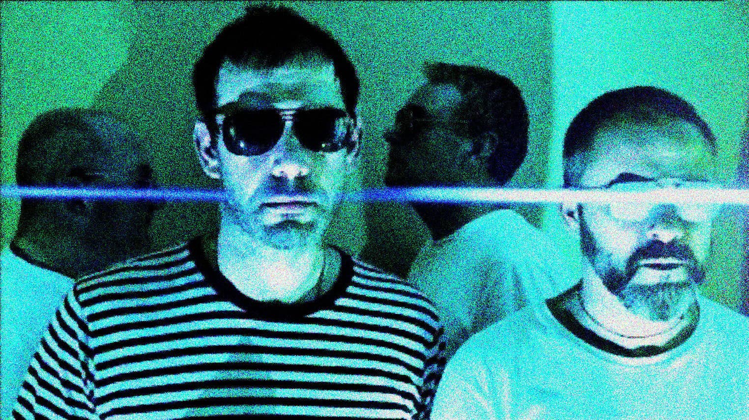 Vintage band members with sunglasses, casual attire, and a retro aesthetic, representing music history and classic rock culture, from a past daily sound archive.