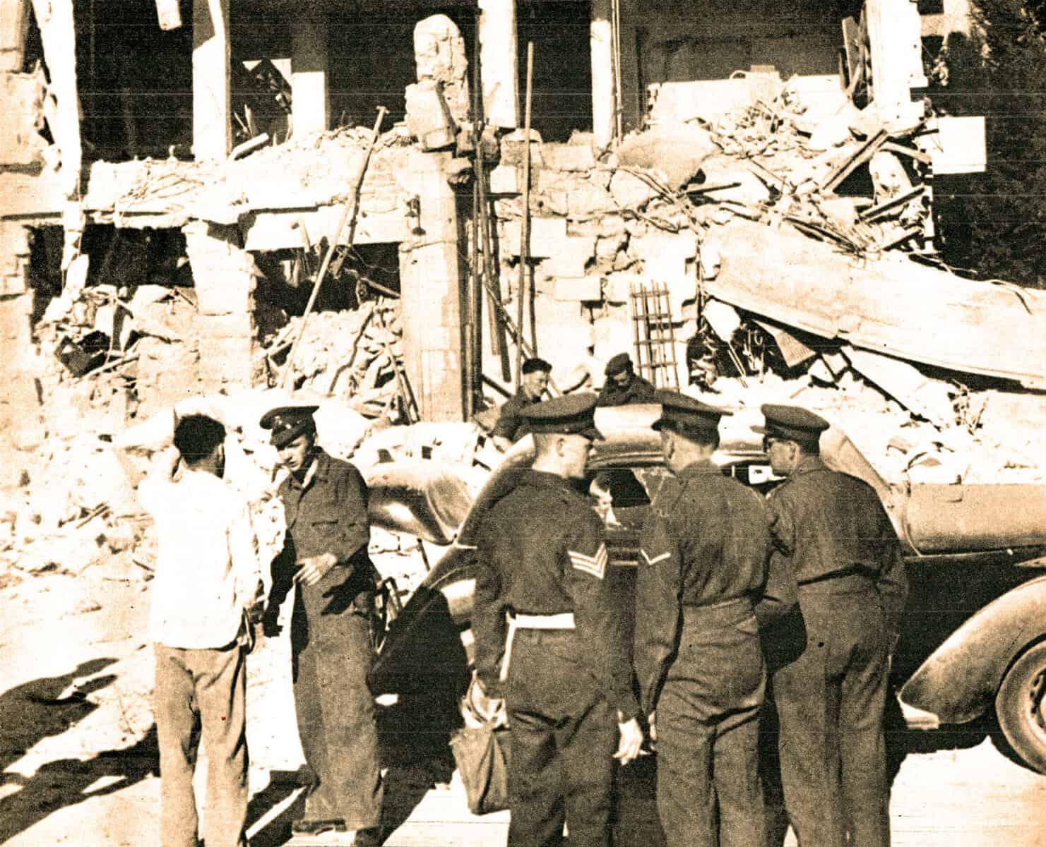 Damaged building ruins after destruction in wartime, with military officers and civilians inspecting the scene, showcasing historical war aftermath, civil defense, and emergency response moments.