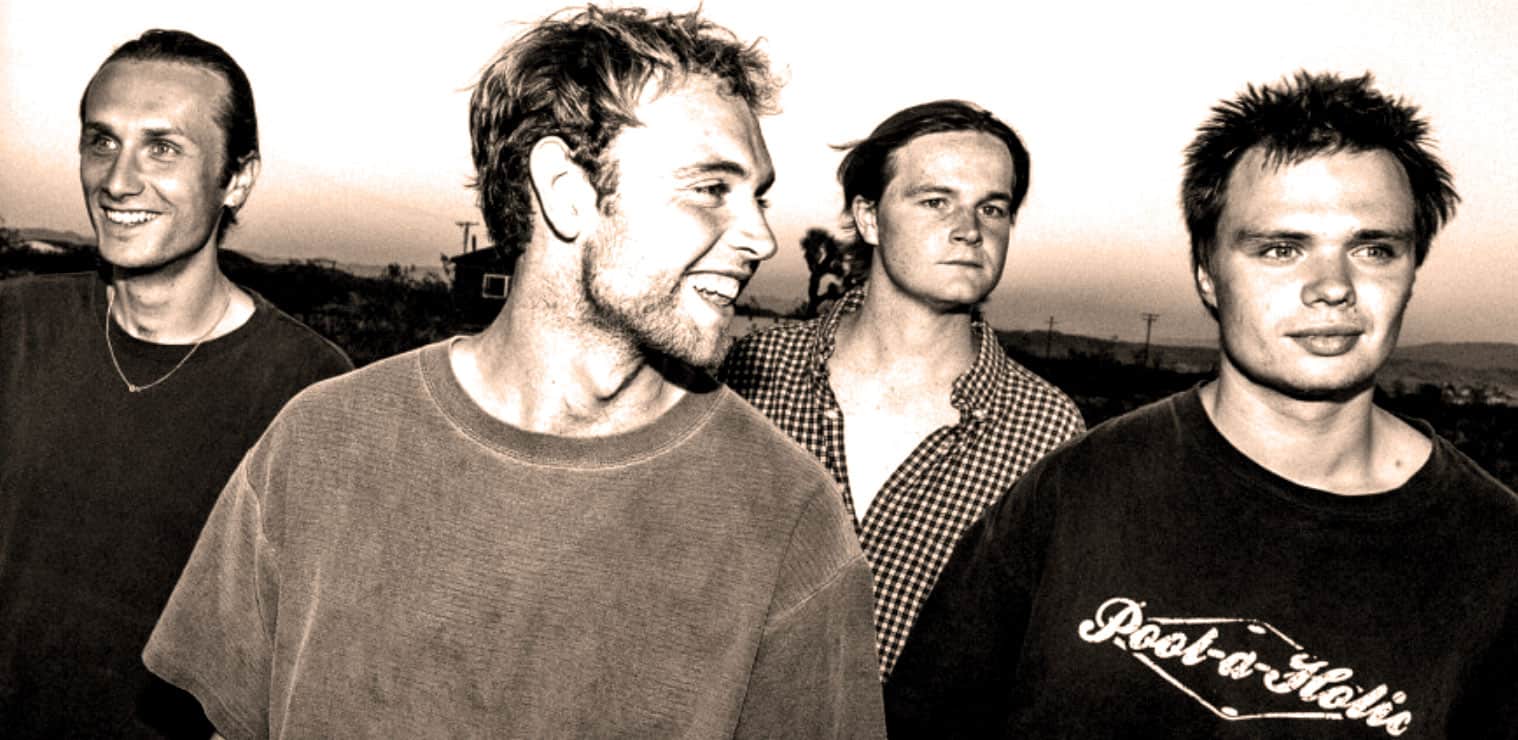 Vintage rock band members outdoor sunset image, classic music scene, alternative rock style, historic music archive photo, nostalgic music scene for audio archives and music history.