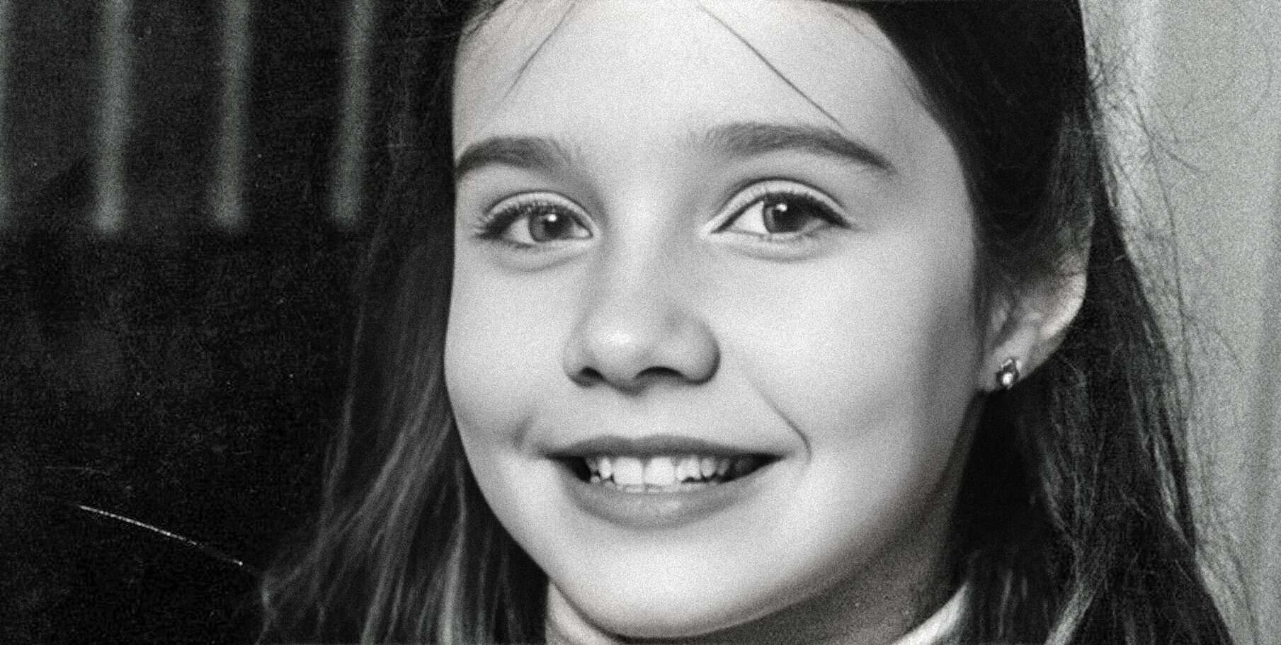 Young girl with a bright smile, showcasing her friendly personality and cheerful expression, perfect for illustrating nostalgia, childhood memories, and classic sound archives.