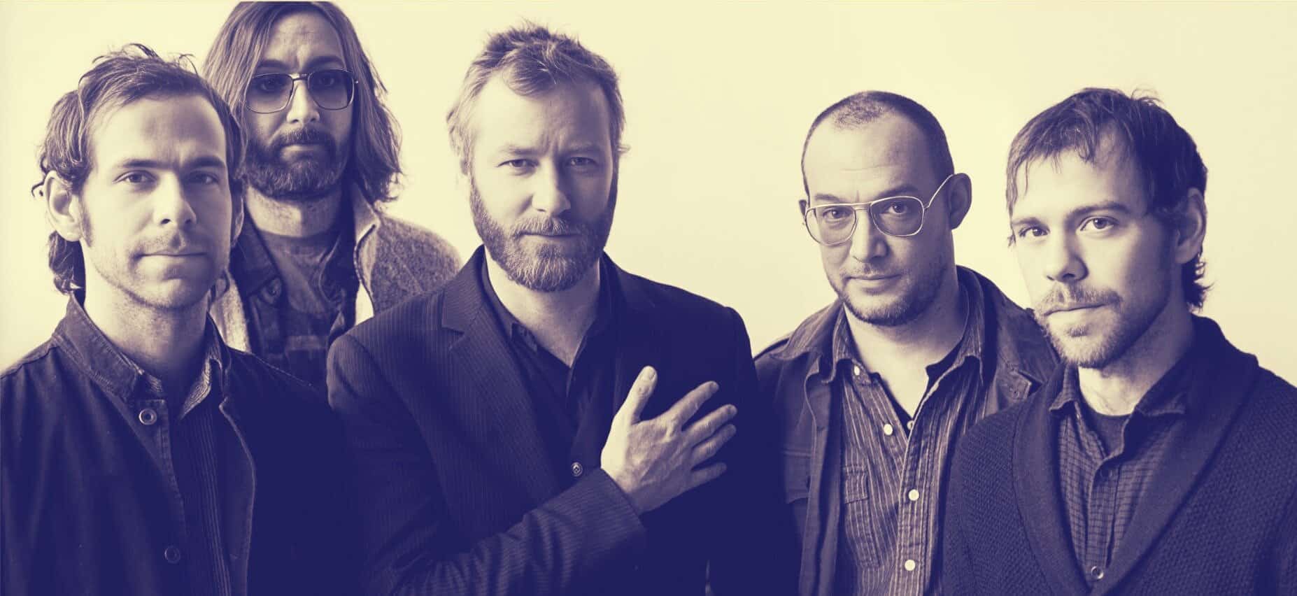 Vintage rock band portrait with members wearing casual and stylish clothing, emphasizing their musical vibe and history-themed connection for SEO on music archives and historical sound collections.