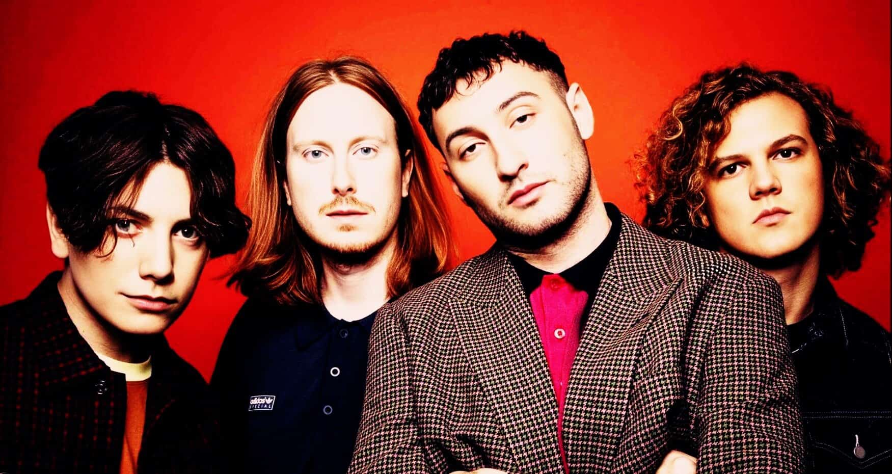 Vintage rock band portrait with vibrant red background, showcasing 1990s alternative music scene, perfect for music history and sound archive content.
