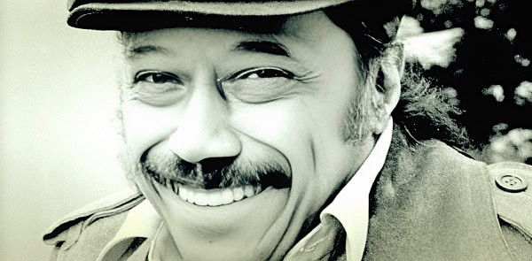Vintage radio announcer smiling, representing historical news and music archives on Past Daily.