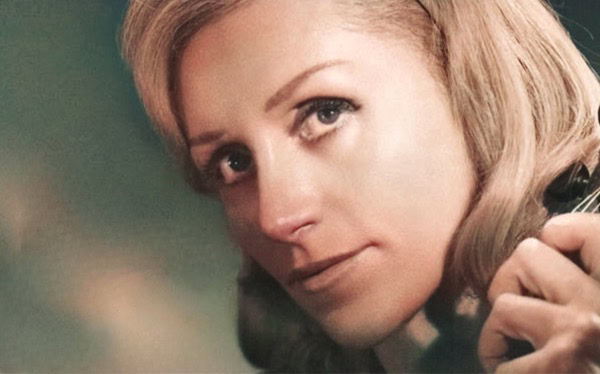 Vintage woman holding a microphone, representing classic news, history, and music archives for Past Daily.