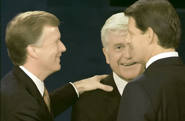 George W. Bush, Bill Clinton, and John Kerry engaging at a political event, capturing a moment of historical significance in U.S. politics and leadership.