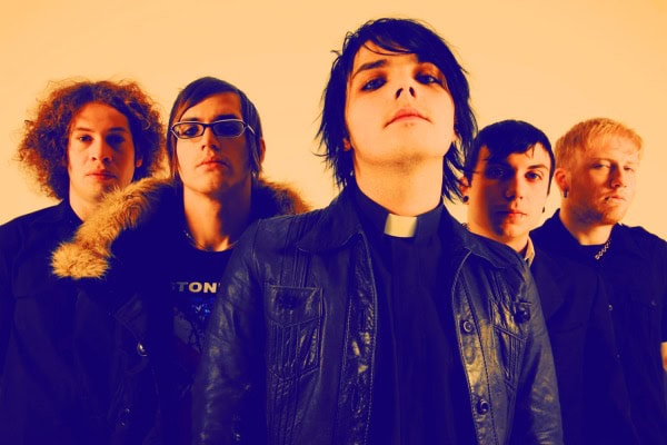 Young alternative rock band members posing together in studio, music photography, past daily sound archive of news, history, and music relevance.