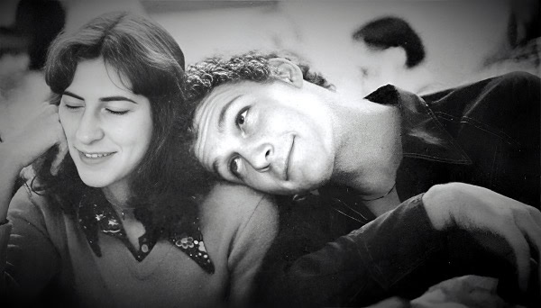Vintage black and white photo of a young couple smiling and enjoying a moment together, capturing nostalgic feelings from the golden age of music, news, and history archive.