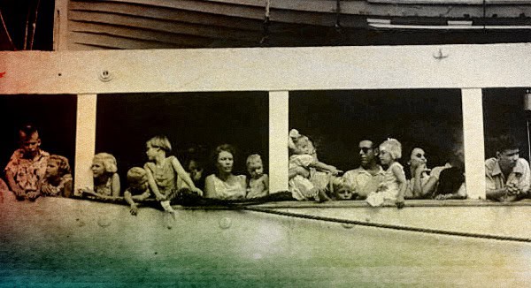 A vintage black-and-white photo of people on a boat, capturing a historical moment with individuals enjoying a boat ride amidst a nostalgic setting.