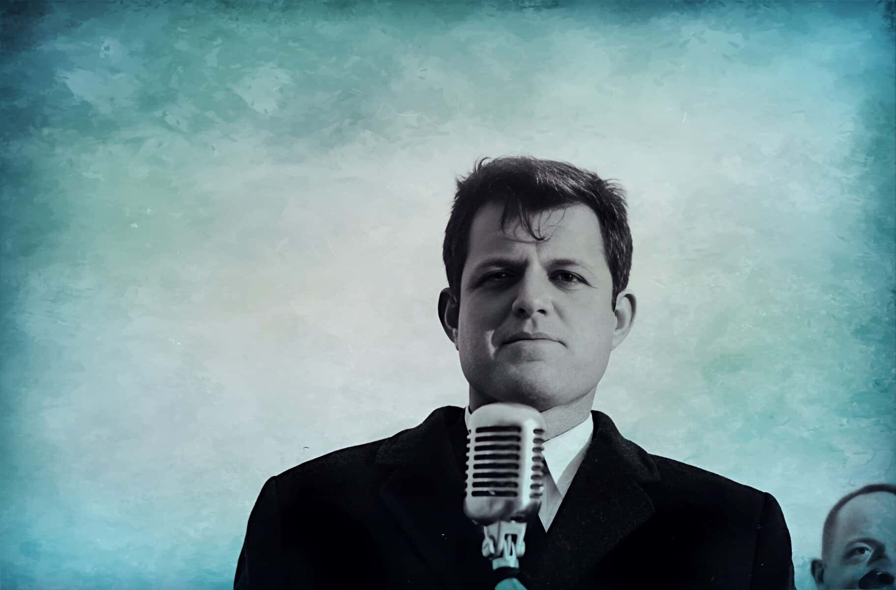 Historic musician with vintage microphone, emphasizing sound archive of news, history, and music from Past Daily; black-and-white documentary style image.