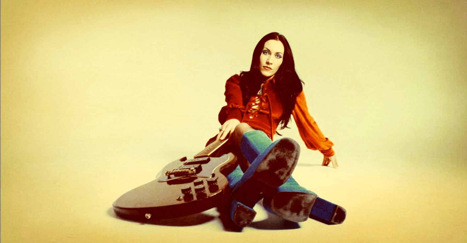 Vintage woman with electric guitar, colorful socks, and retro style portrait, music and entertainment theme.