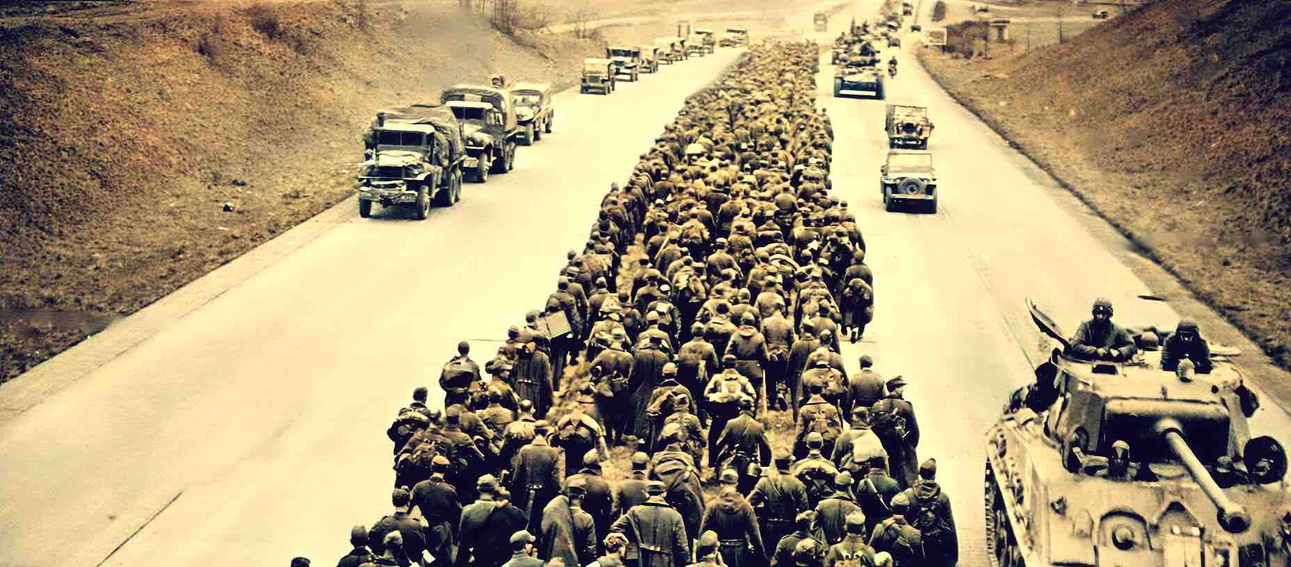 Refugees marching along a dusty road with military vehicles, historical war migration scene representing news, history, and music archive themes.