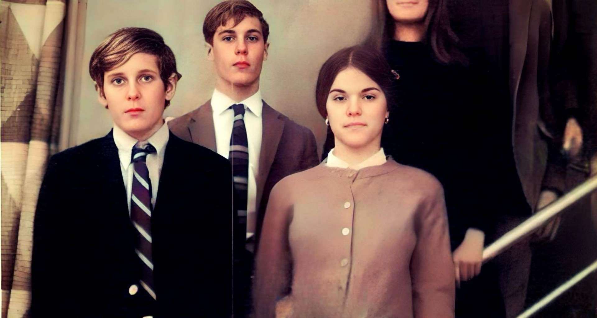 Historical film scene of teenage students in school uniforms, vintage interior background, from the 1960s or 1970s, illustrating youth culture and education history, from the Past Daily archive.