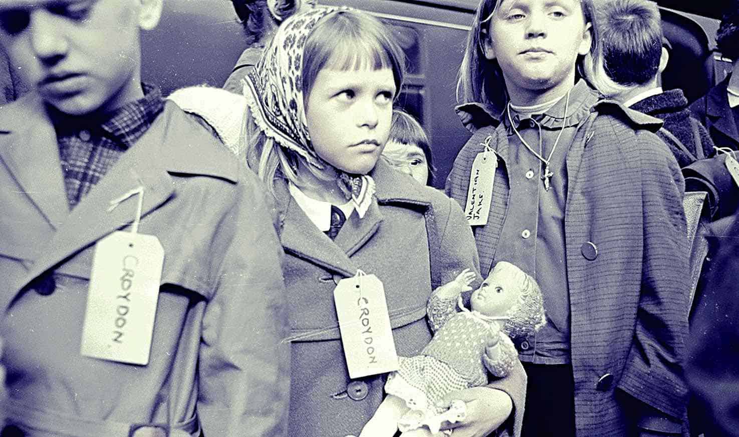 Children protesting with "CROVOON" tags on their coats during a historical event, highlighting news coverage of social movements and youth activism from the past.