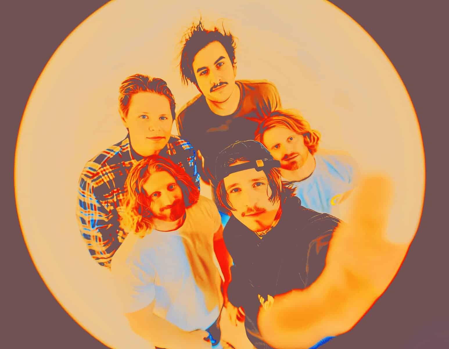 Vintage rock band photo with members featuring hairstyles and fashion from the 1990s, representing music history and cultural nostalgia.