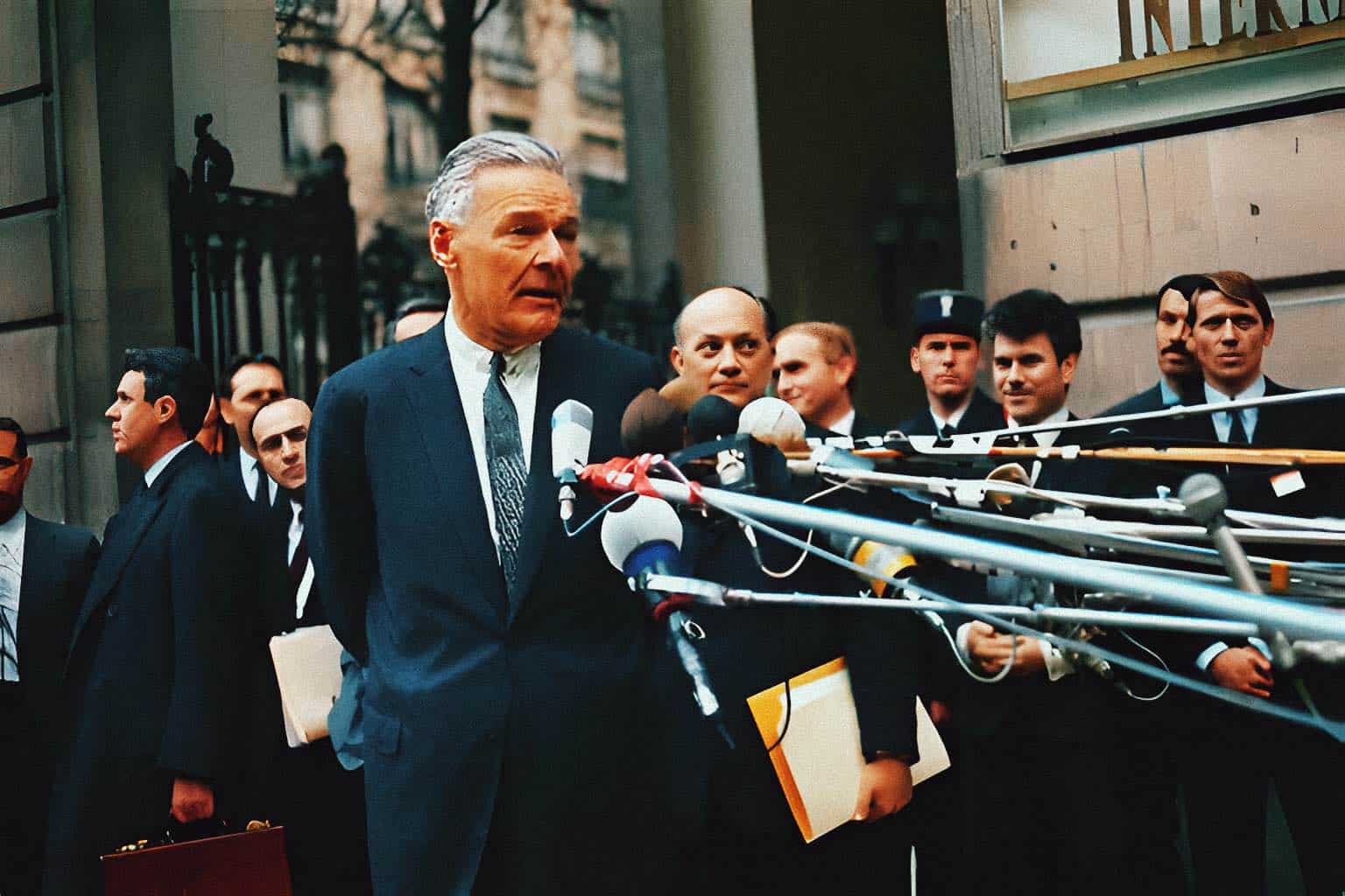 Radio news conference with journalists and microphones in an urban setting, capturing historical media coverage and journalists reporting on current events.