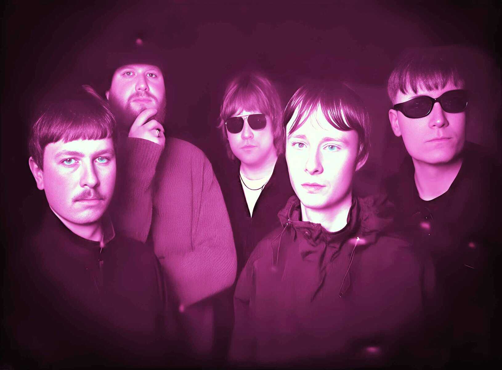 Vintage band portrait with members wearing dark sunglasses and stylish clothing, highlighting music history and iconic moments from the past. Perfect for retro music and sound archive themes.
