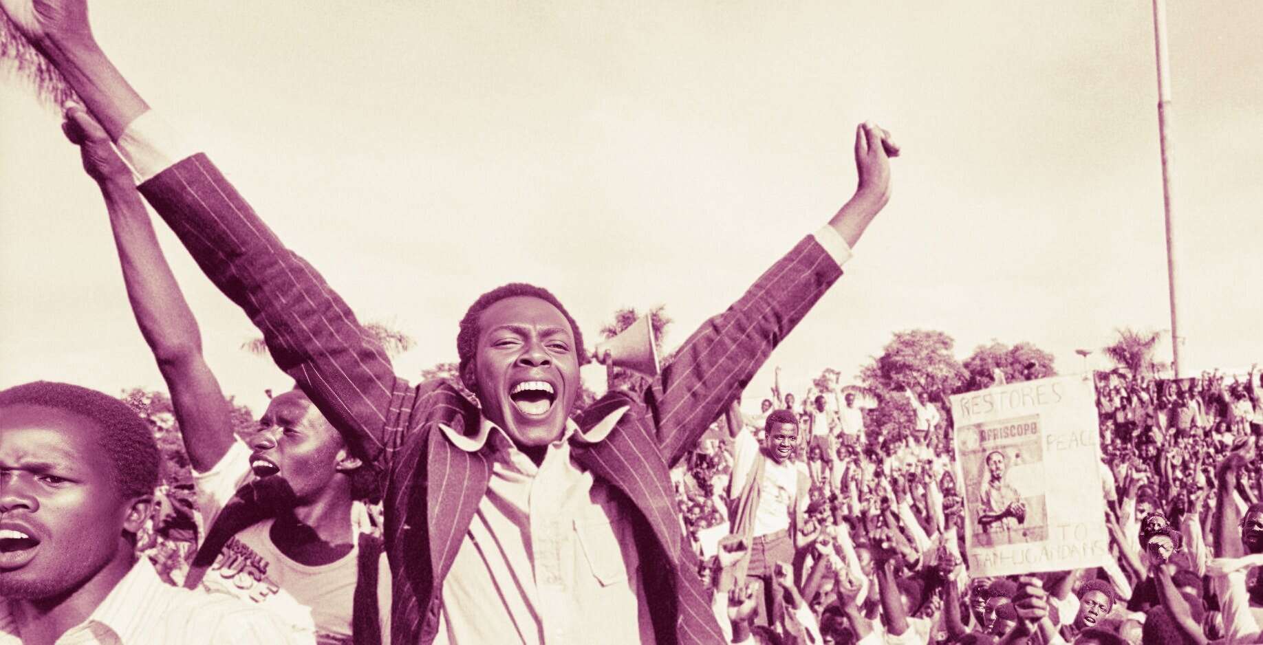 Protesters demonstrating for social justice and historical change, holding signs and expressing enthusiasm at a rally or march, capturing moments of activism, news, and community engagement.