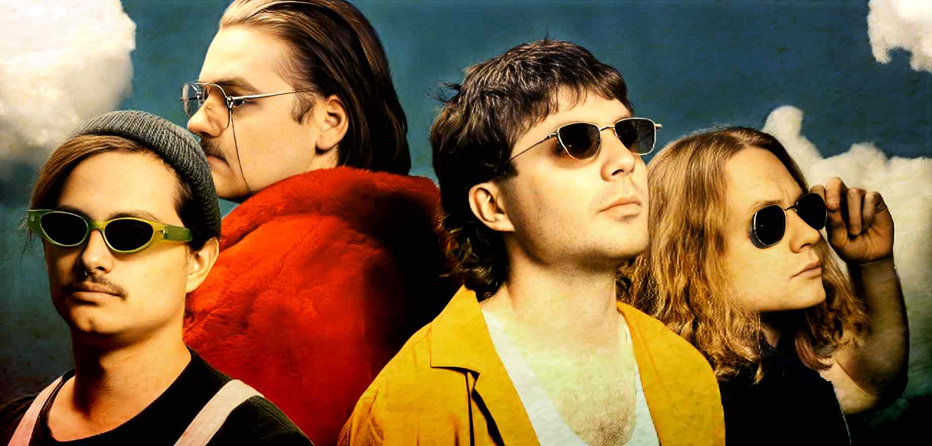 Vintage rock band members wearing sunglasses with a cloudy sky background for nostalgia, music, and history-themed SEO.